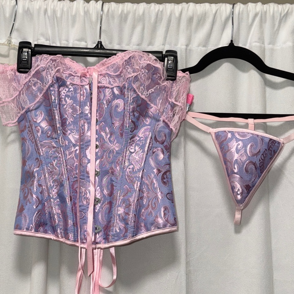 Lovely Pink & Bluish Lavender Corset
Size Small with matching panty NIB
